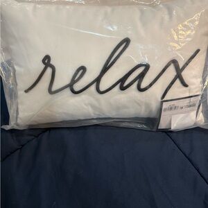 White Pillow with Black 'Relax' Embroidery